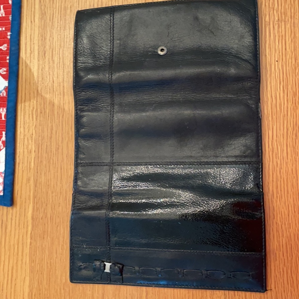 Supple black leather and patent  Ferragamo wallet